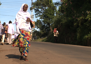 The conflict in Sierra Leone ended in 2002. A woman walks in Freetown, August 2010. Photo by Neil Cole.